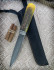 Нож "Северный-2", клинок Дамасская сталь, рукоять шишка в акриле желтого цвета, притин мельхиор