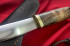 Нож "Северный-2", клинок сталь K340, кованый дол, рукоять стабилизированная карельская береза коричневого цвета, латунь с ручной обработкой